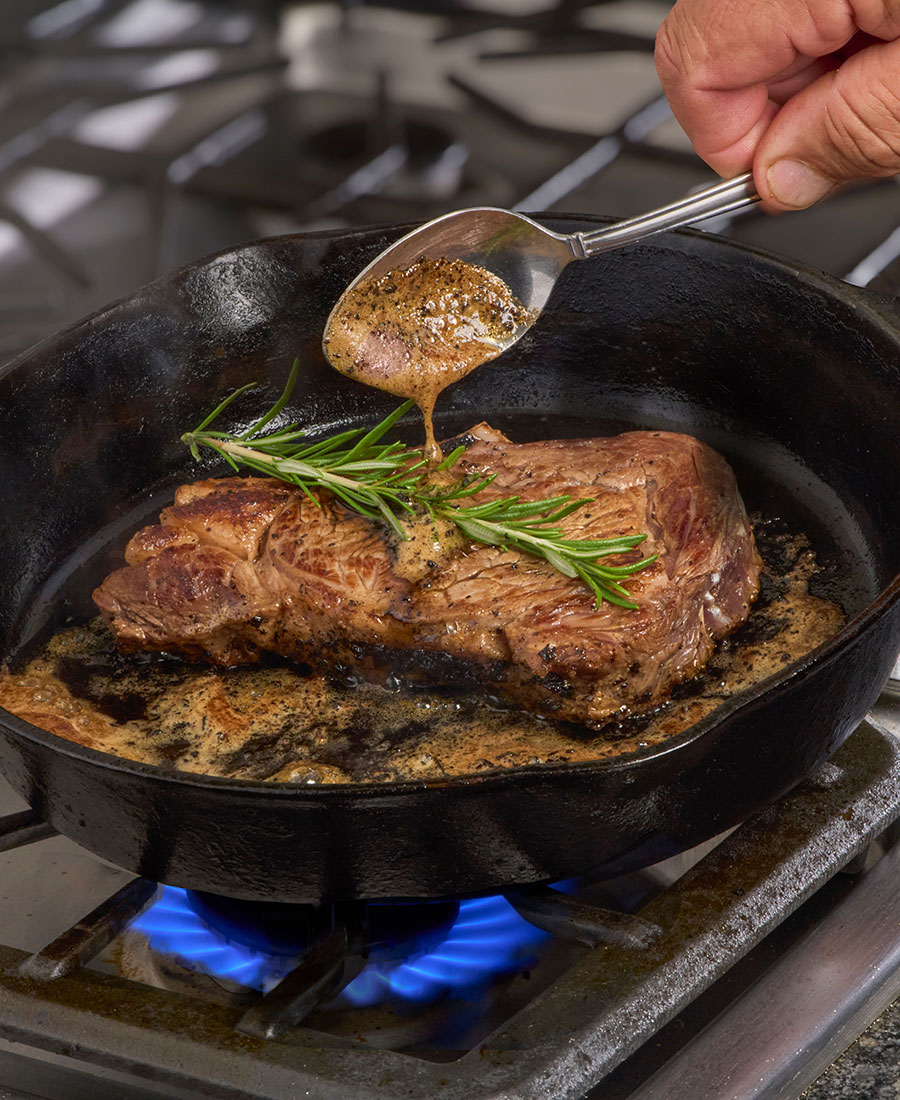 Thick Cut Cast Iron Seared Steaks with Garlic Butter